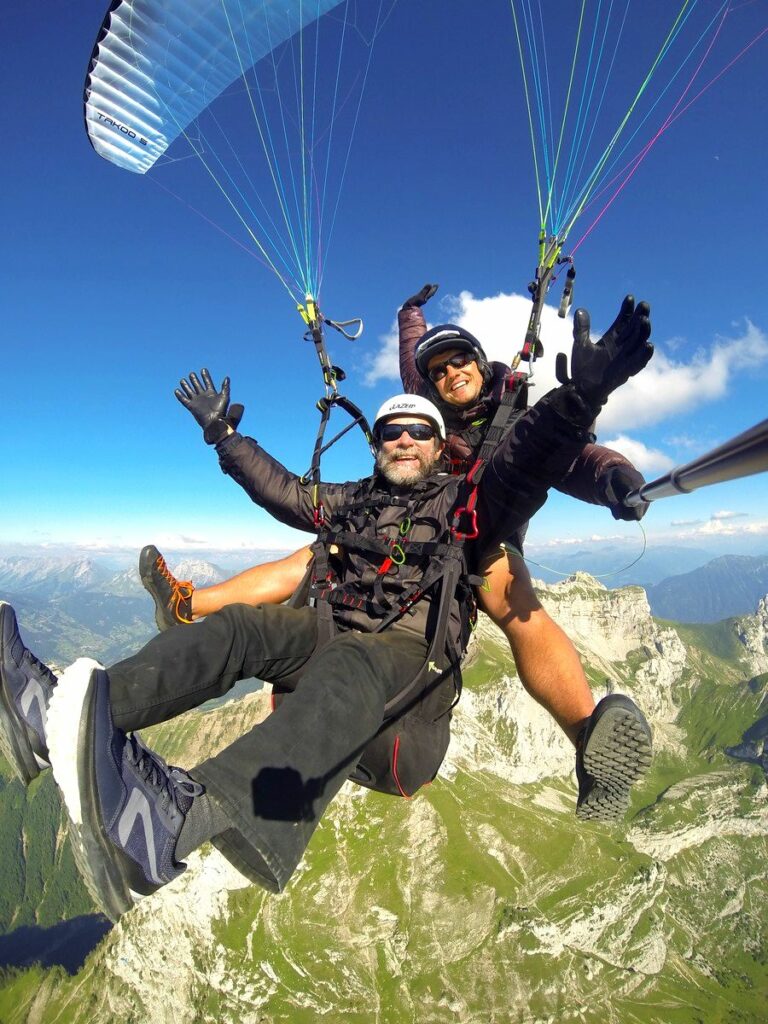 Majestic paragliding flight in alps